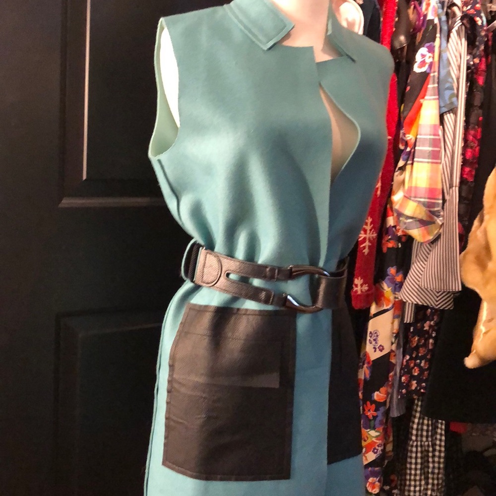 Blue sleeveless overcoat w faux leather pockets